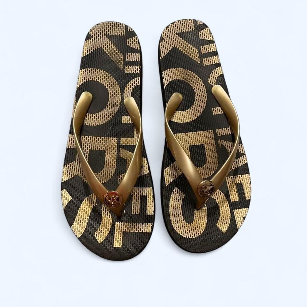 Gold and black logo flip flops size 11 by Michael Kors